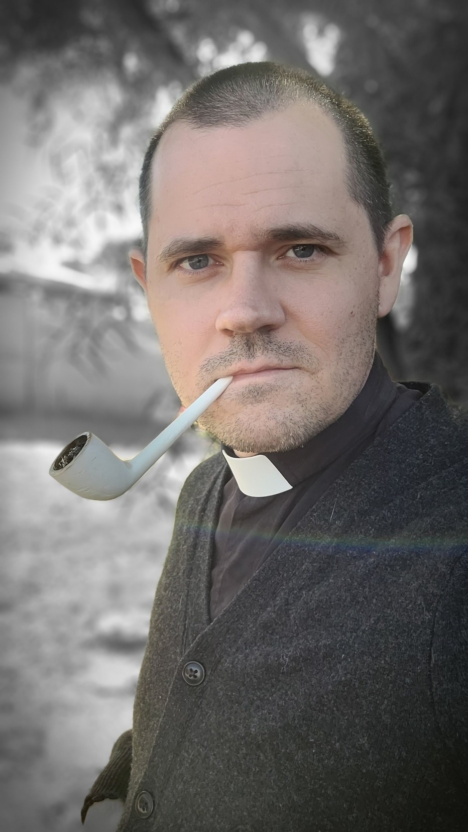 Fr. Nathan smoking a clay pipe